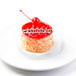 fresh-homemade-jelly-cake-garnished-with-cherry