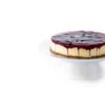 Sweet cheesecake with blueberries isolated on white background